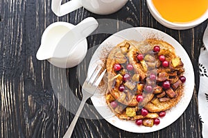 Hot french toasts with caramelized apples, and tea