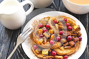 Hot french toasts with caramelized apples, and tea