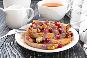 Hot french toasts with caramelized apples, and tea