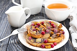 Hot french toasts with caramelized apples, and tea