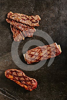 Hot Fresh Gaucho Steak and Flank Steak on Barbecue Grill Background