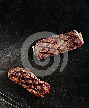 Hot Fresh Gaucho Steak or Flank Steak on Barbecue Grill Background