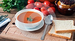 Hot fresh homemade tomato soup with thyme, top view
