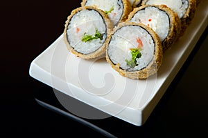 Hot fried Sushi Roll with with vegetables. Set sushi menu.