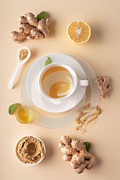 hot ginger tea with honey lemon and mint on a light background