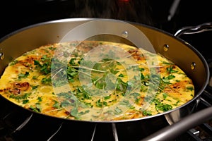 hot, golden-brown frittata cooling on stovetop