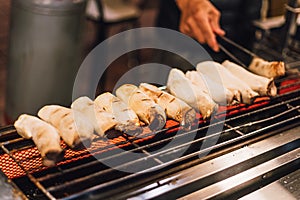 Hot Grilled Eryngii Mushroom on electric stove. Street food at Jiantan in Taipei, Taiwan