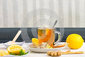 Hot hebal tea on table top with other ingredients