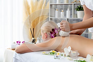 Hot herbal ball spa massage body treatment at day spa . Quiescent