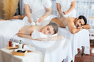 Hot herbal ball spa massage body treatment at day spa . Quiescent