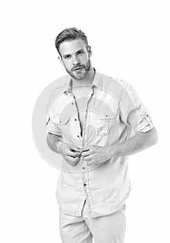 It is hot here. Man handsome bearded guy undressing white background isolated. Guy confident attractive macho feels sexy