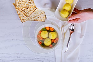 Hot Homemade Matzo Ball Soup in a Bowl Passover wine and matzah