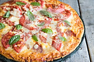 Hot Homemade Pepperoni Pizza on a rustic wooden table. Pizza wit