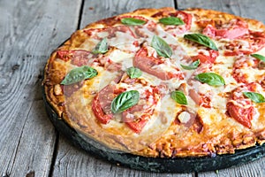 Hot Homemade Pepperoni Pizza on a rustic wooden table. Pizza wit