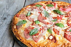 Hot Homemade Pepperoni Pizza on a rustic wooden table. Pizza wit