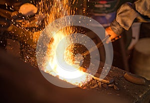 Hot horseshoe in forge.