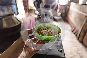Hot instant noodle in green color cup in grocery store at Thangu and Chopta valley in winter in Lachen. North Sikkim, India