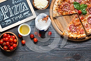 Hot Italian pizza on a rustic wooden table.