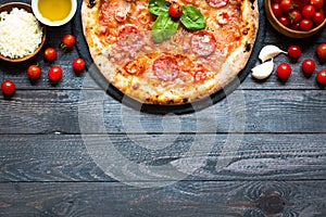 Hot Italian pizza on a rustic wooden table.