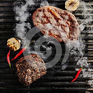 Hot Juicy Ribeye Steak on Barbecue Grill Background