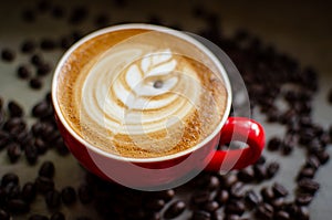 Hot latte art in red mug