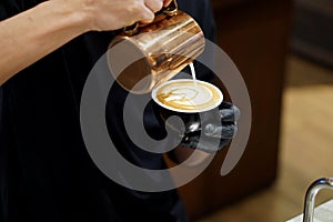 Hot latte - Barista making coffee with latte art, Created by pouring steamed milk into a shot of espresso and resulting in a