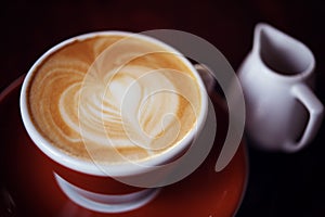 Hot Latte Coffee in coffee shop on table wooden