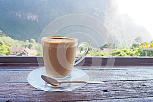 Hot latte coffee with nature background