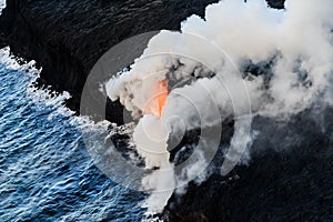 Hot lava flows into the cold ocean water off Hawaii