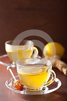 Hot lemon ginger tea in glass cup