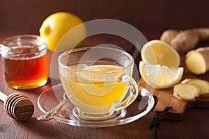 Hot lemon ginger tea in glass cup