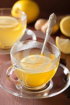 Hot lemon ginger tea in glass cup