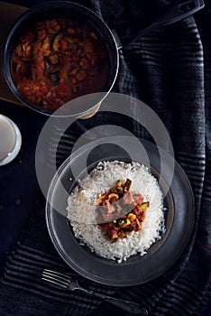 Hot letcho with rice on dark background