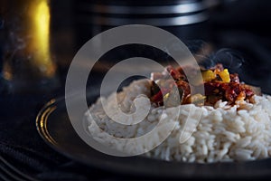 Hot letcho with rice on dark background