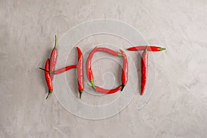 HOT lettering is lined with pods of red hot chili peppers