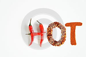 `HOT` lettering made from chili peppers, chili flakes and chili powder