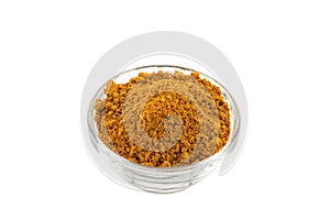 Hot madras curry powder in glass bowl photo