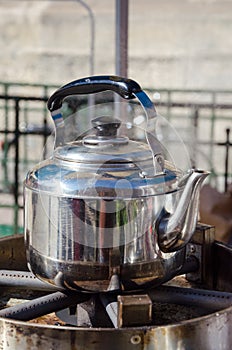 A hot metallic tea kettle