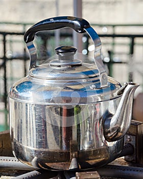 A hot metallic tea kettle