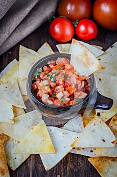 Hot mexican salsa - spicy dip with nachos - chips from corn