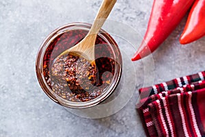 Hot Mexican Spicy Chili Red Sauce Salsa Macha with Red Pepper Powder in Jar.