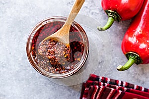 Hot Mexican Spicy Chili Red Sauce Salsa Macha with Red Pepper Powder in Jar.