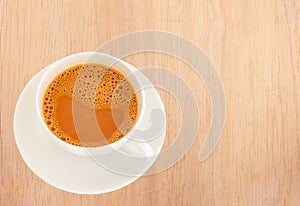 Hot milk tea in a white cup