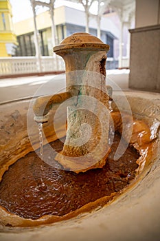 Hot mineral spring in Mill colonnade or Mlynska kolonada in Karlovy Vary spa, Czech Republic