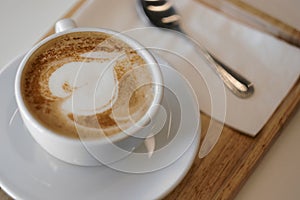 Hot mocha coffee or capuchino with heart pattern photo