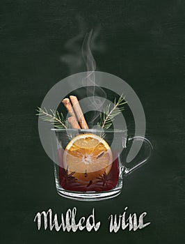 Hot mug of christmas mulled wine with orange, cinnamon and spices, on a black background