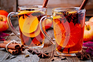 Hot mulled apple cider with cinnamon sticks, cloves and anise