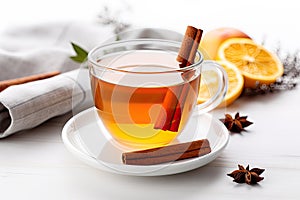 Hot mulled apple cider with with cinnamon sticks, cloves and anise