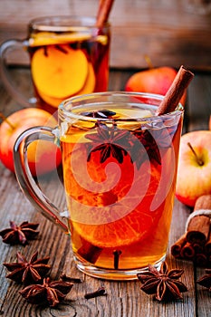 Hot mulled apple cider with cinnamon sticks, cloves and anise