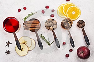 Hot mulled wine with fruits and spices ingredients